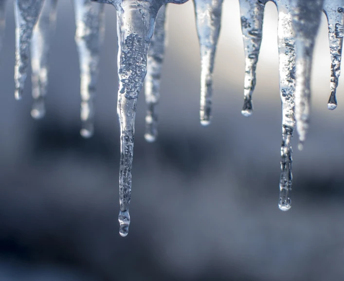 a group of icicles hanging from the side of a building, a microscopic photo, romanticism, closeup photo, outdoor photo, high res photo, jungian symbols of winter