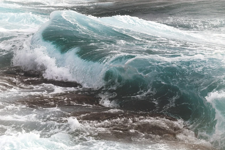 a man riding a wave on top of a surfboard, a picture, fine art, waves crashing at rocks, the blue whale crystal texture, closeup cinematic aquatic scene, 1128x191 resolution