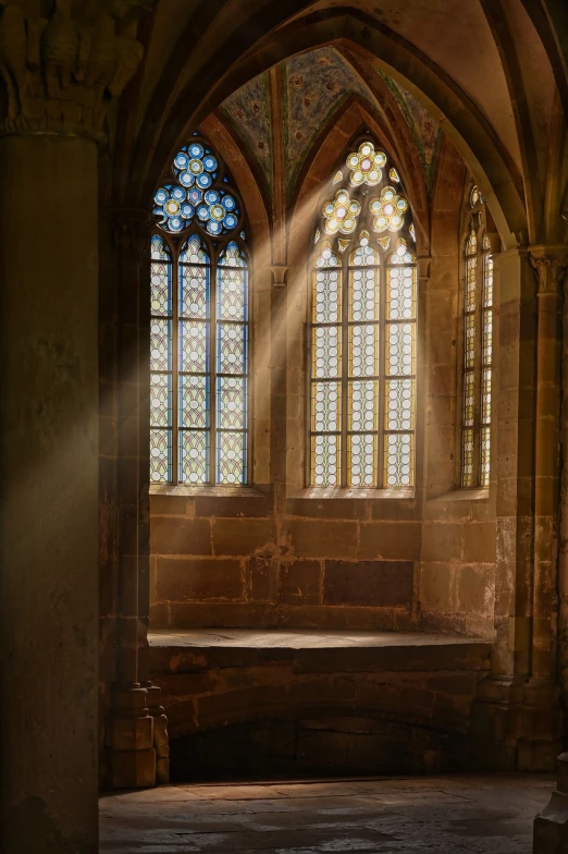 sunlight shines through a stained glass window in a church, a detailed matte painting, inspired by Hans Memling, shutterstock, renaissance, sitting in a castle, ethereal beams, backlighted, light from window