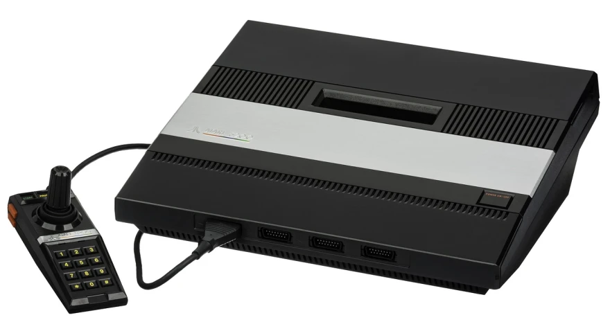 a video game console sitting next to a remote control, a computer rendering, inspired by Jan Karpíšek, neogeo, close-up product photo, black, circa 1 9 7 9, 4 k product photo