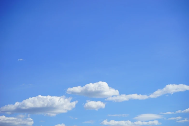 a group of people on a beach flying a kite, minimalism, beautifull puffy clouds. anime, today\'s featured photograph 4k, cumulus clouds, sky!