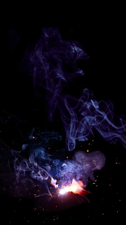 a close up of a fire with smoke coming out of it, a picture, by Jan Rustem, pexels, digital art, purple bioluminescence, halloween wallpaper with ghosts, background image, smoking vessels