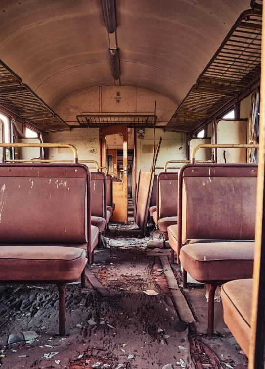 a bunch of seats sitting inside of a train car, by Matthias Weischer, shutterstock, graffiti, rust and dust and fire and dirt, lost in despair, bussiere rutkowski andreas rocha, vintage old