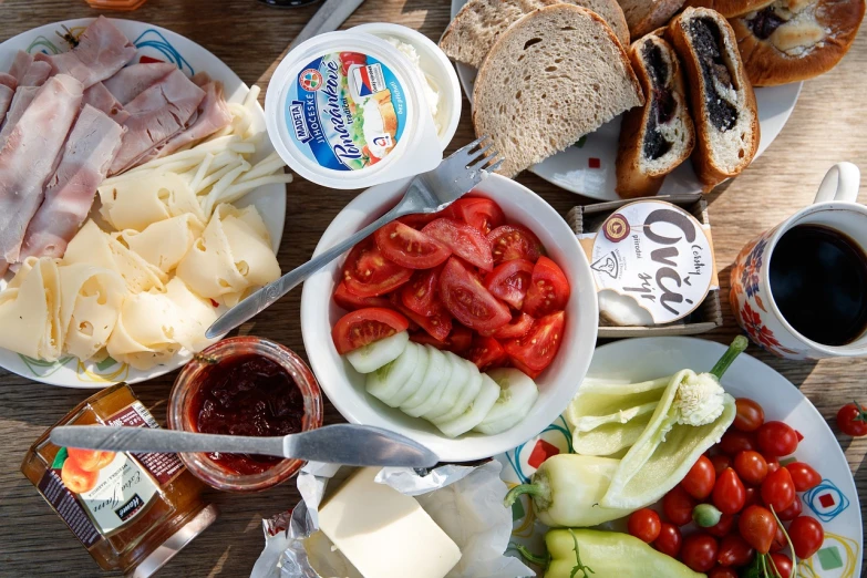 a wooden table topped with plates of food, by Dietmar Damerau, southern slav features, cheeses, high quality product image”