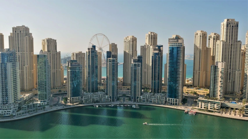 a large body of water surrounded by tall buildings, by Edmund Greacen, shutterstock, hurufiyya, gulf, aerial, tourist destination, footage