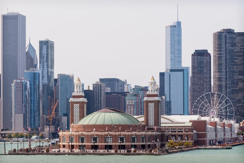 a large building sitting in the middle of a body of water, by Emanuel Witz, shutterstock, chicago skyline, skydome, 3 / 4 extra - wide shot, round-cropped