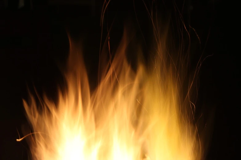 a close up of a fire in the dark, a picture, istockphoto, fire hair, pc screen image, an ultrafine detailed photo