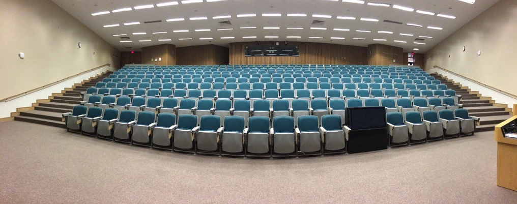 a lecture hall with rows of blue chairs, by Robert Medley, flickr, 3 6 0 panorama, phone photo, koyaanisqatsi, by greg rutkowski