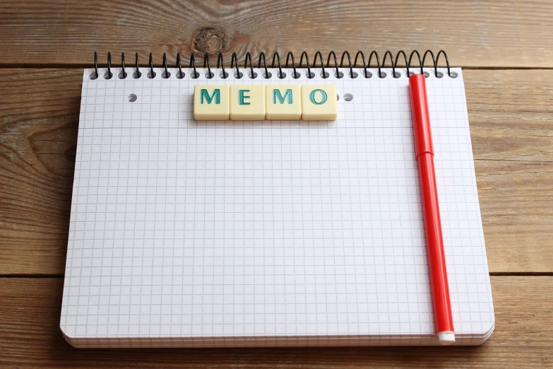 a notepad sitting on top of a wooden table, a picture, by Bernard Meninsky, shutterstock, remodernism, memories, meow, flat lay, mmo