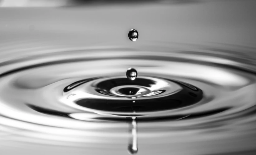 a black and white photo of a drop of water, pexels, honey ripples, made of liquid metal, wallpaper - 1 0 2 4, hq 4k wallpaper