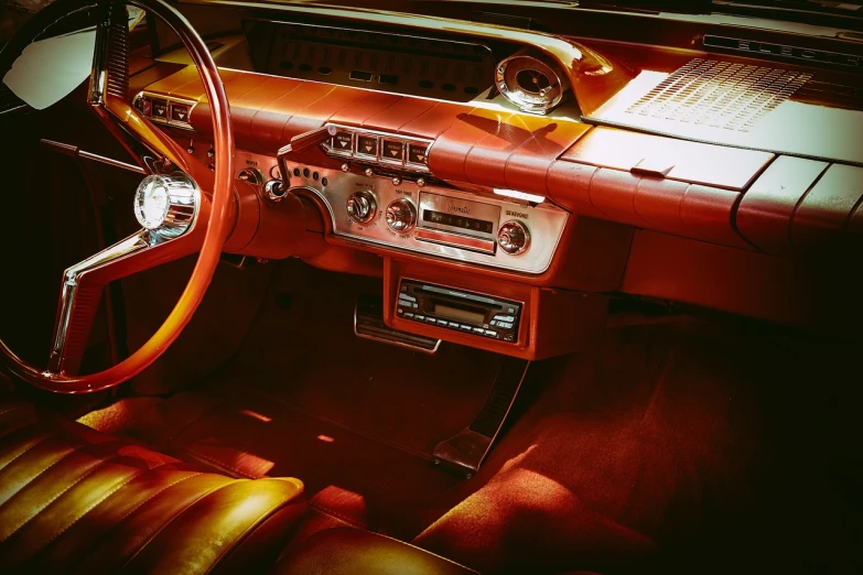 a close up of a dashboard of a car, a colorized photo, by Pamela Ascherson, pexels, retrofuturism, red and brown color scheme, lowrider style, the console is tall and imposing, mid-century modern furniture