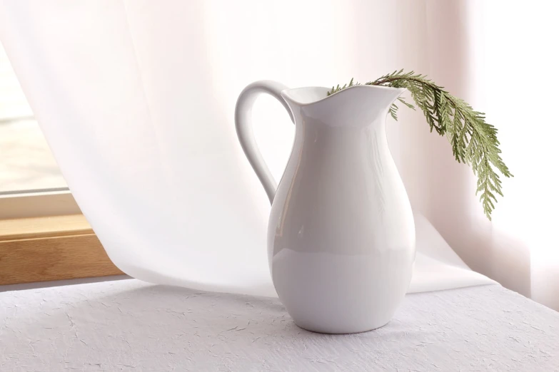 a white pitcher sitting on a table next to a window, a still life, inspired by Hendrik Gerritsz Pot, pixabay, minimalism, beautiful smooth oval head, with soft bushes, highly detailed product photo, festive