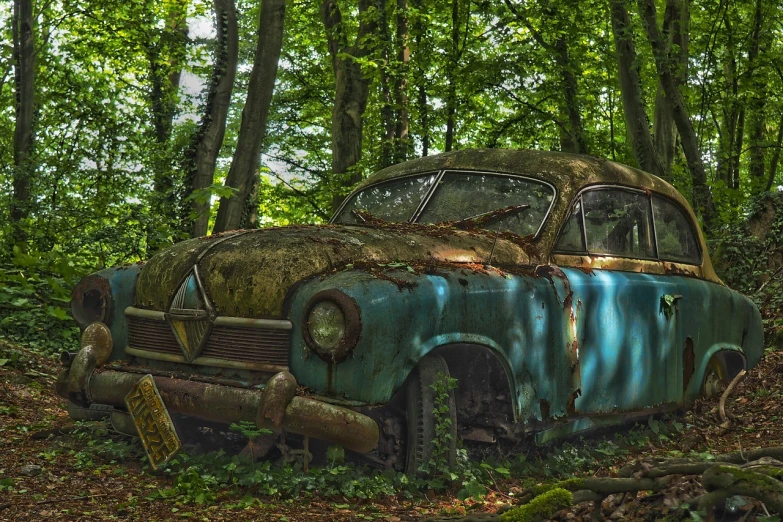 an old car sitting in the middle of a forest, by Ludwik Konarzewski, pixabay contest winner, fantastic realism, photorealism. trending on flickr, cyan, old scars, vintage - w 1 0 2 4