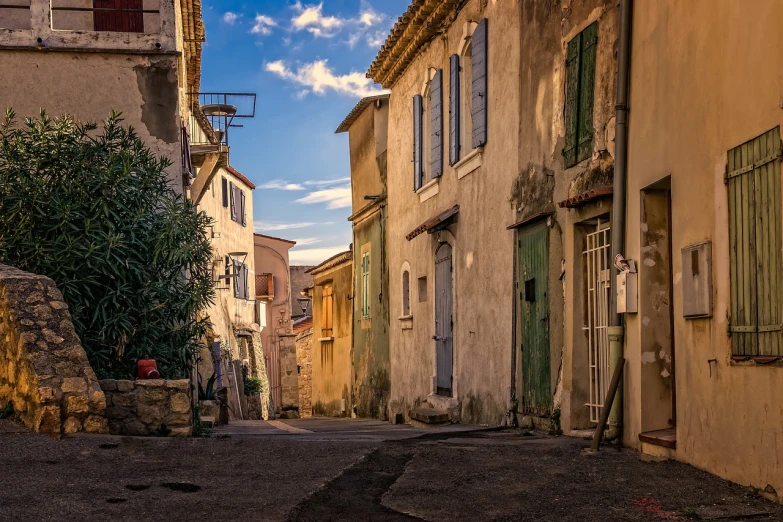 a couple of buildings that are next to each other, a pastel, by Fabien Charuau, shutterstock, renaissance, busy small town street, deep shadows and colors, rural, an abandoned old