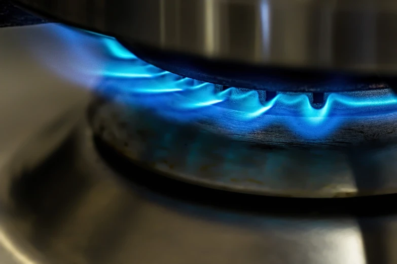 a close up of a gas stove with blue flames, a photo, bauhaus, high res photo, very accurate photo, portlet photo