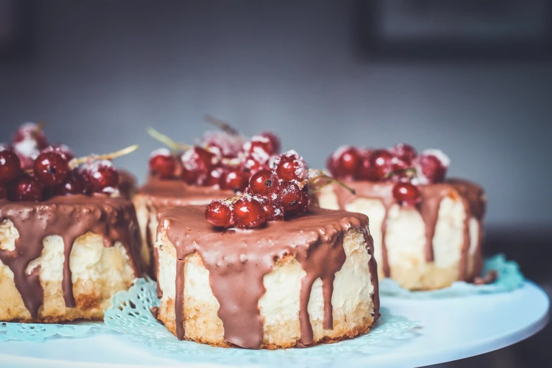 a couple of cakes sitting on top of a white plate, shutterstock, romanticism, cherries, modern high sharpness photo, glaze, taken with canon 8 0 d