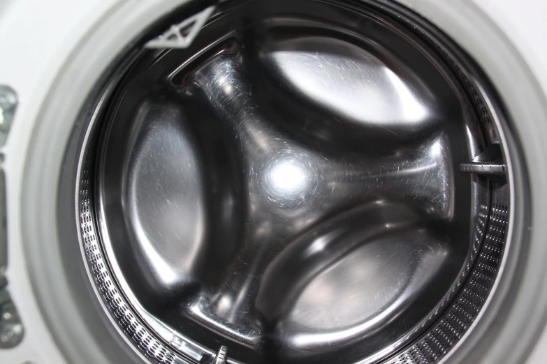 a close up of the inside of a washing machine, productphoto, smooth shiny metal, b - roll, mold