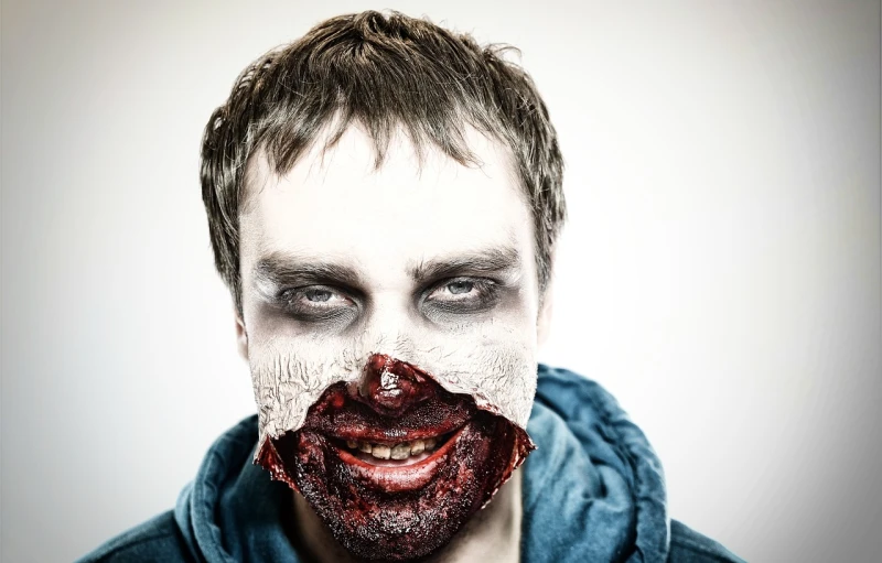 a close up of a person with a bloody face, a photo, by Aleksander Gierymski, shutterstock, lowbrow, man mutating to zombie, hi-res photo, wide shot photo, age 2 0