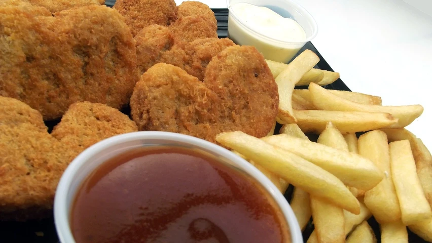 a close up of a plate of food with fries and ketchup, inspired by Pia Fries, flickr, dau-al-set, chicken nuggets, heart, round-cropped, australian