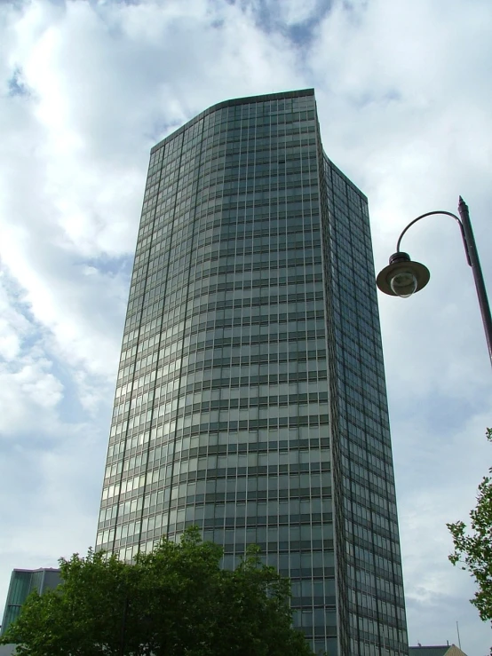 a tall building with a street light in front of it, by Hans Schwarz, flickr, glass and metal : : peugot onyx, wikimedia commons, front view 2 0 0 0, buffalo