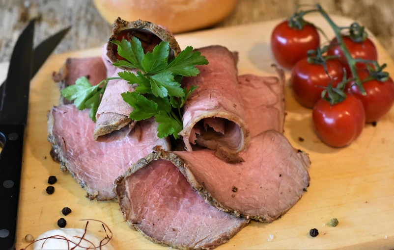 a wooden cutting board topped with meat and vegetables, a portrait, by Maksimilijan Vanka, pixabay, brown bread with sliced salo, hanging beef carcasses, photostock, smoked layered