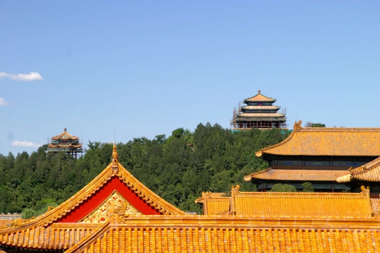 a view of a building with a tower in the background, a picture, flickr, cloisonnism, forbidden city, roofed forest, beautiful sunny day, summer morning