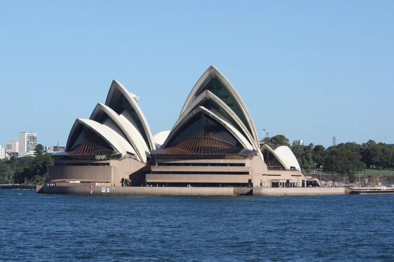 a large building sitting on top of a body of water, inspired by Sydney Carline, the three moiras, wikipedia, architecture photo