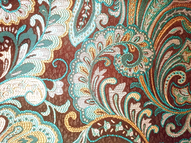 a close up of a fabric with a pattern on it, baroque, brown and cyan color scheme, rich vibrant detailed textures, intricate paisley filigree, 70s colors