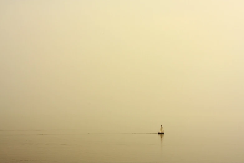 a small boat floating on top of a large body of water, a picture, inspired by Sanford Robinson Gifford, flickr, minimalism, during sandstorm, seaview, kodak photo, lonely rider