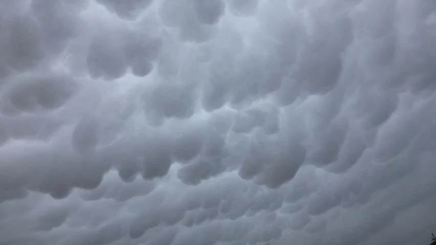 a group of people standing on top of a beach under a cloudy sky, by Jan Konůpek, precisionism, mammatus clouds, [ closeup ]!!, complex ceiling, mid closeup