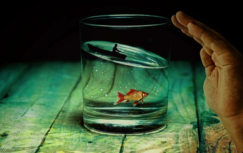 a hand holding a glass with a goldfish in it, by Cyril Rolando, photorealism, alexander jansson style, miniature photography, floating alone, half fish