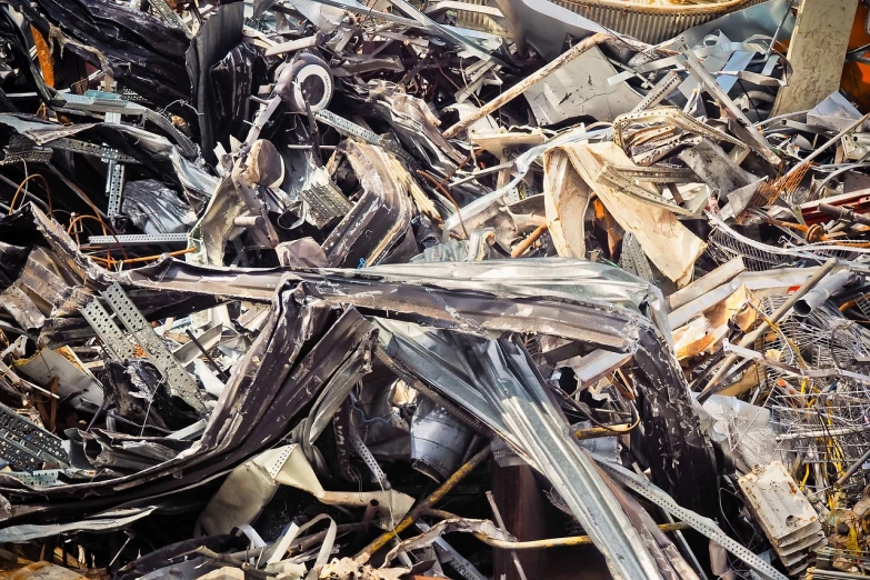 a pile of junk sitting next to a fire hydrant, a stock photo, shutterstock, plasticien, metallic polished surfaces, metal panels, tangles of metallic cables, panorama