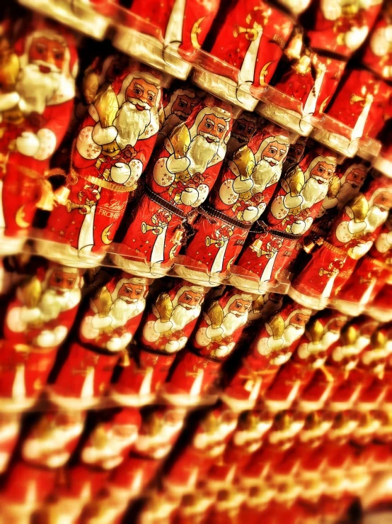 a display of red and gold dolls in a store, a tilt shift photo, by Aleksander Gierymski, pop art, cans, santa clause, made out of sweets, aaaaaaaaaaaaaaaaaaaaaa