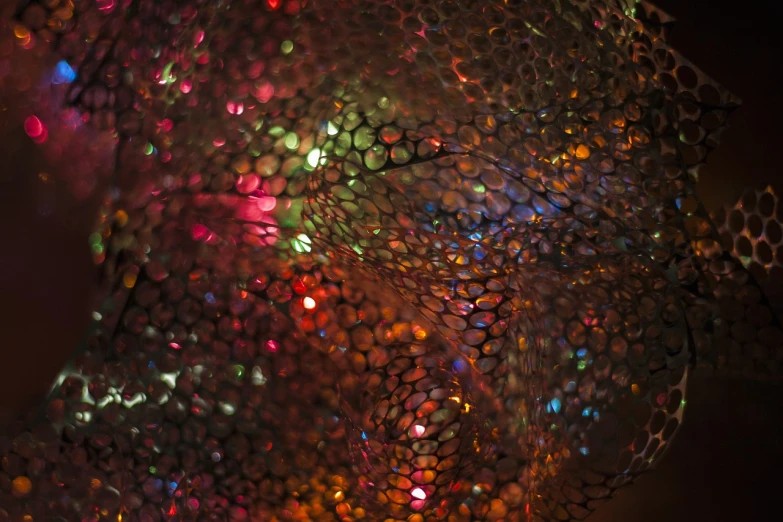 a bunch of bubbles sitting on top of a table, a microscopic photo, by Jan Rustem, flickr, glowing stained glass backdrop, glistening skin, seen from below, mesh structure