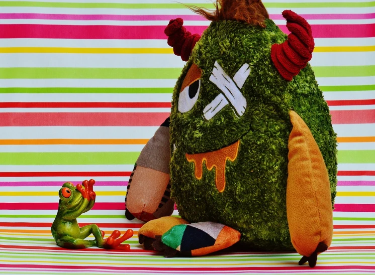 a couple of stuffed animals sitting next to each other, a photo, inspired by Kagaku Murakami, pexels, process art, ((monster)), fighting monster with magic, peepo the frog!!!, decaying rich colors!