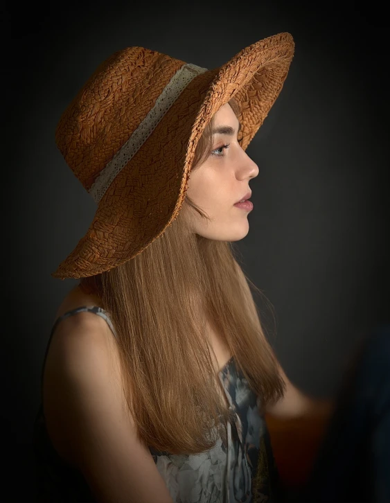 a woman with long hair wearing a brown hat, a character portrait, inspired by Anna Boch, shutterstock, studio portrait photo, angle profile portrait, high detail portrait photo, underexposed lighting