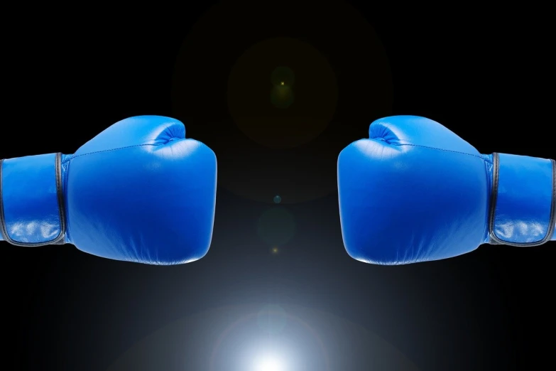 a pair of blue boxing gloves on a black background, a digital rendering, set photo, inflateble shapes, close up photo, complaints