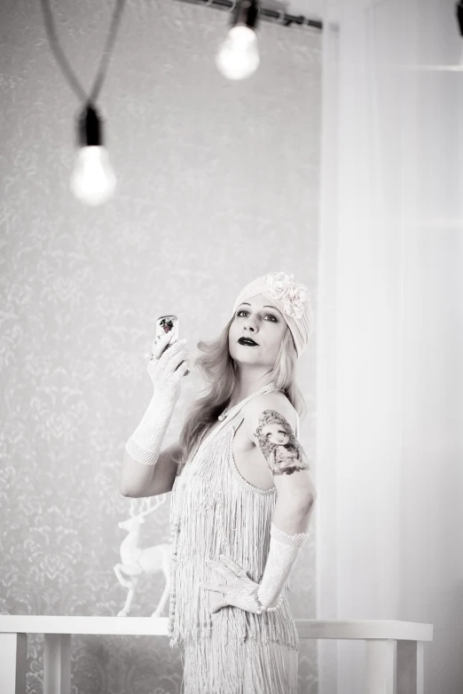 a black and white photo of a woman in a dress, a portrait, inspired by Cecil Beaton, tumblr, art nouveau, lady gaga as evita, antique perfume, concept photoset, dressed in a beautiful white