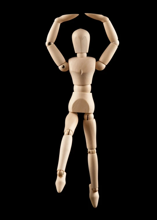 a wooden mannequin standing in front of a black background, by Julian Allen, shutterstock, visual art, 3 / 4 view from back, with arms up, ball jointed doll, detailed product photo