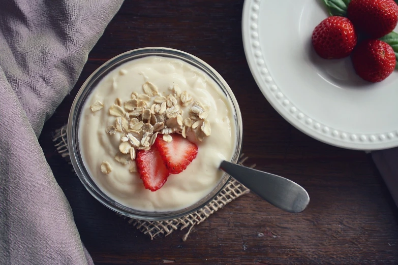 a bowl of yogurt next to a plate of strawberries, pexels, renaissance, the god of oatmeal, “organic, alex flores, avatar image