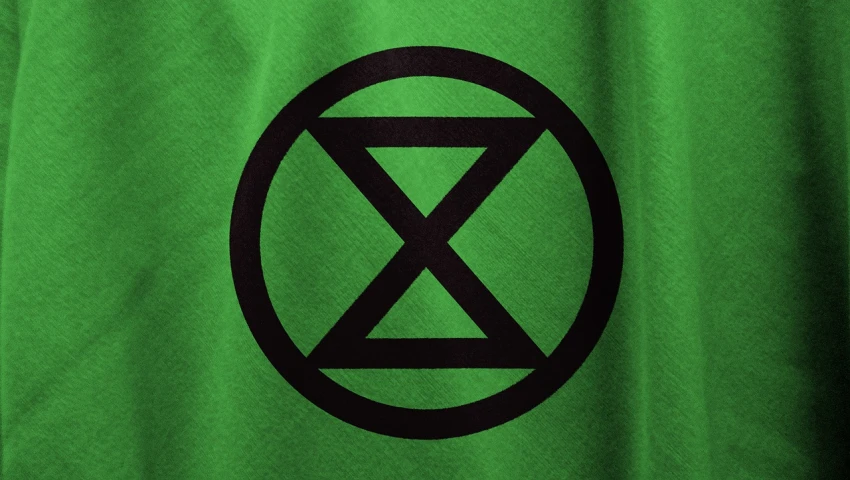 a green shirt with a black x symbol on it, by Rodney Joseph Burn, deviantart, excessivism, 4 k detail, xmen, tank, sustainable materials