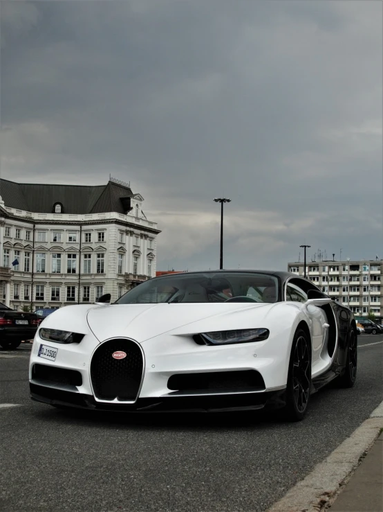 a white buggy parked on the side of the road, inspired by Harry Haenigsen, baroque, chiron, high quality 4 k, that resembles a bull\'s, massive wide trunk