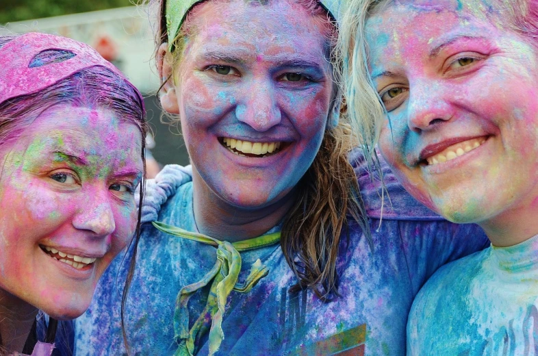 a group of women standing next to each other, a portrait, by Tom Carapic, flickr, color field, vibrant powder paints, happy girl, 5 k, closeup!!