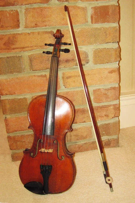 a violin sitting next to a brick wall, flickr, long bow and arrows, standing on top of a violin, stained”, petite