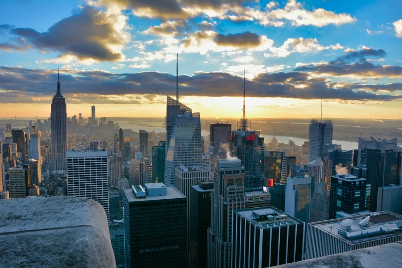 a view of a city from the top of a building, by Richard Hess, shutterstock, new - york skyline in winter, usa-sep 20, sun set, f / 2. 5