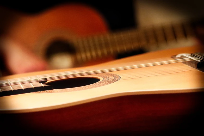 a close up of a guitar with a blurry background, by Juan O'Gorman, flickr, realism, dlsr photo, lute, new mexico, version 3