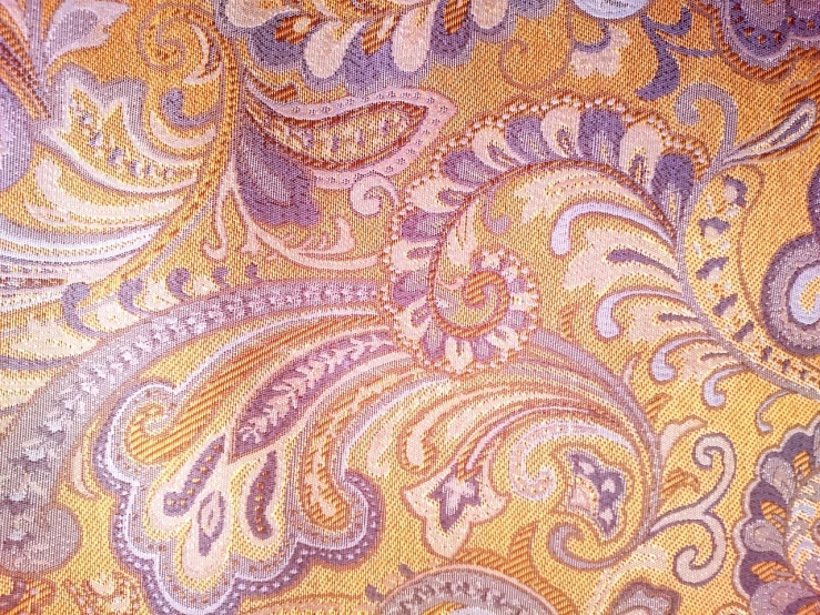 a close up of a tie on a table, inspired by Hermenegildo Anglada Camarasa, baroque, lavander and yellow color scheme, detailed color scan”, paisley, 7 7 7 7