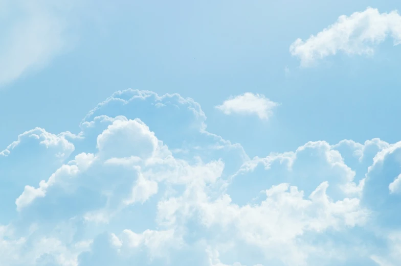 a large jetliner flying through a cloudy blue sky, a picture, by Rhea Carmi, shutterstock, minimalism, cotton candy clouds, soft blue texture, sunny day with clear sky, rinko kawauchi