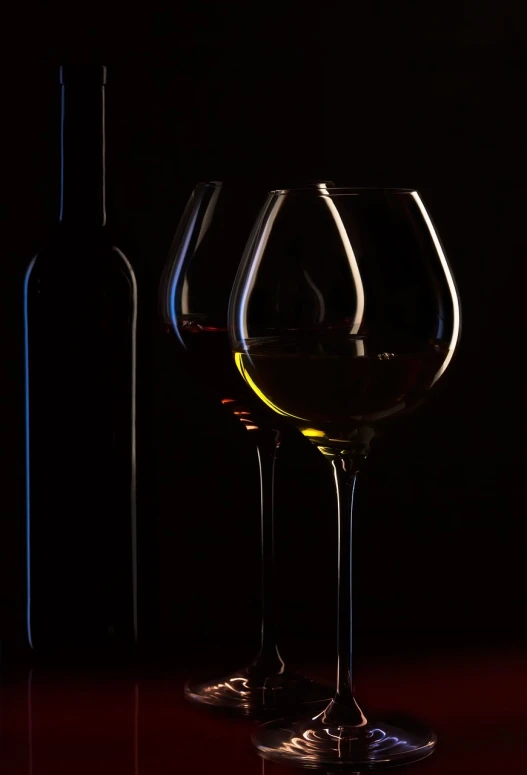 two wine glasses and a bottle on a table, a still life, minimalism, shot at night with studio lights, deep shadows and colors, product photo