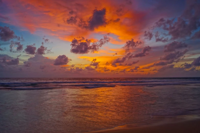 a person holding a surfboard on a beach at sunset, a photo, by Alexander Sharpe Ross, shutterstock, romanticism, sri lanka, red stormy sky, sunset panorama, stock photo